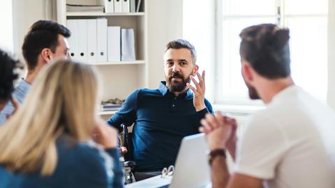 Business meeting around an office conference table