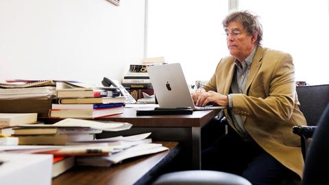 Richard McNally at work in his office