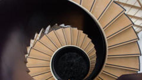 Downward view of CGIS Knafel's spiral staircase