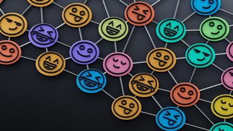 Multicolored emojis connected by network lines on a dark field