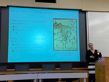 Emily Sellars presenting during a conference session