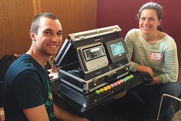 students at event with media