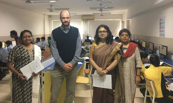Teaching digital cartography in a computer lab at Sri Sri Academy in Kolkata.