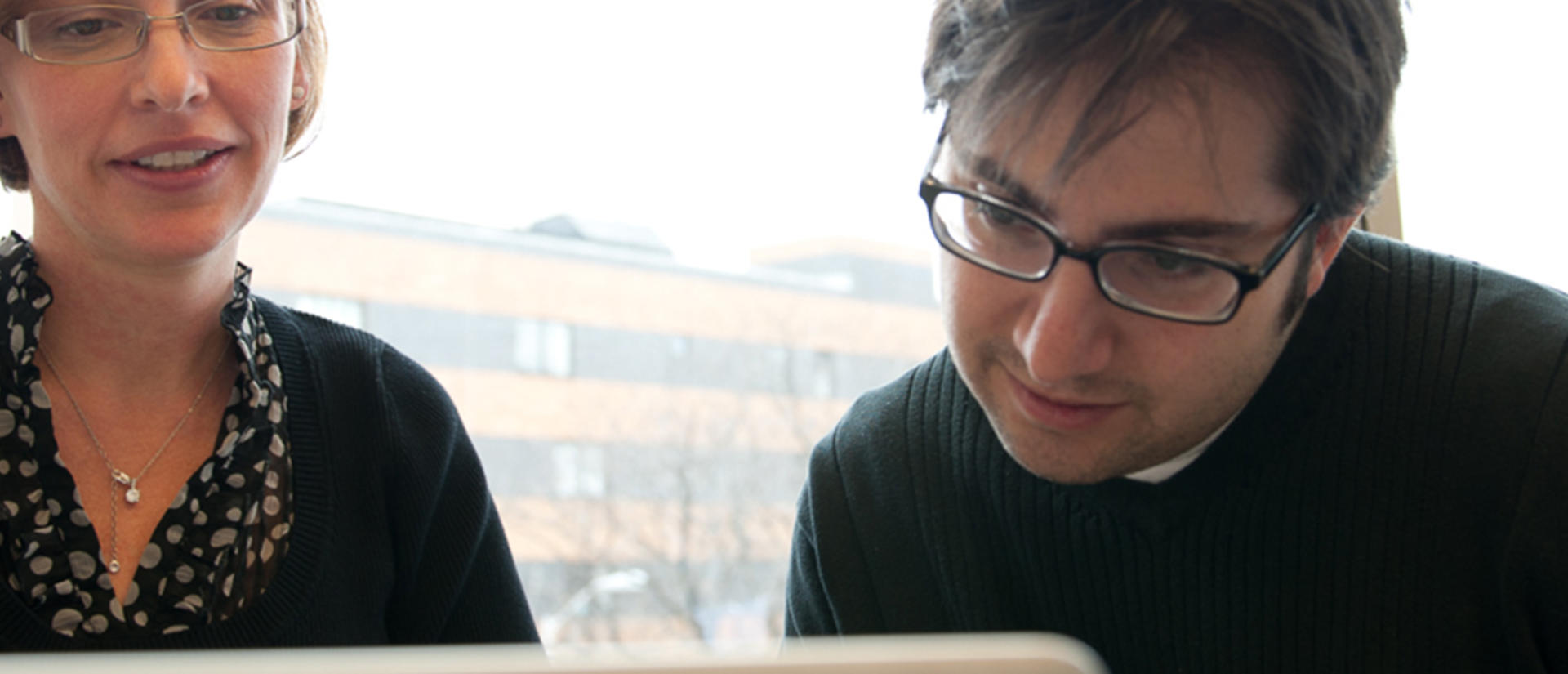 staff looking at computer